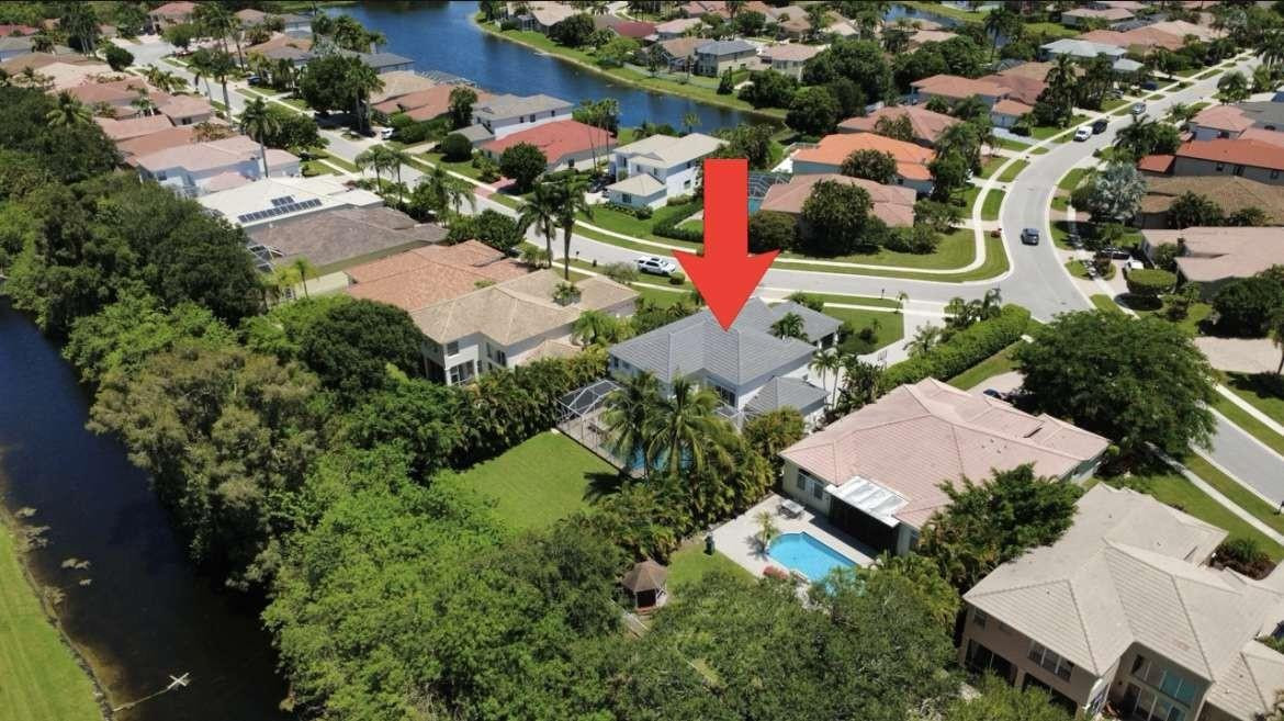 11119 Blue Coral Drive Boca Raton, FL 33498 - Photo 35 of 36 an aerial view of a house with a yard