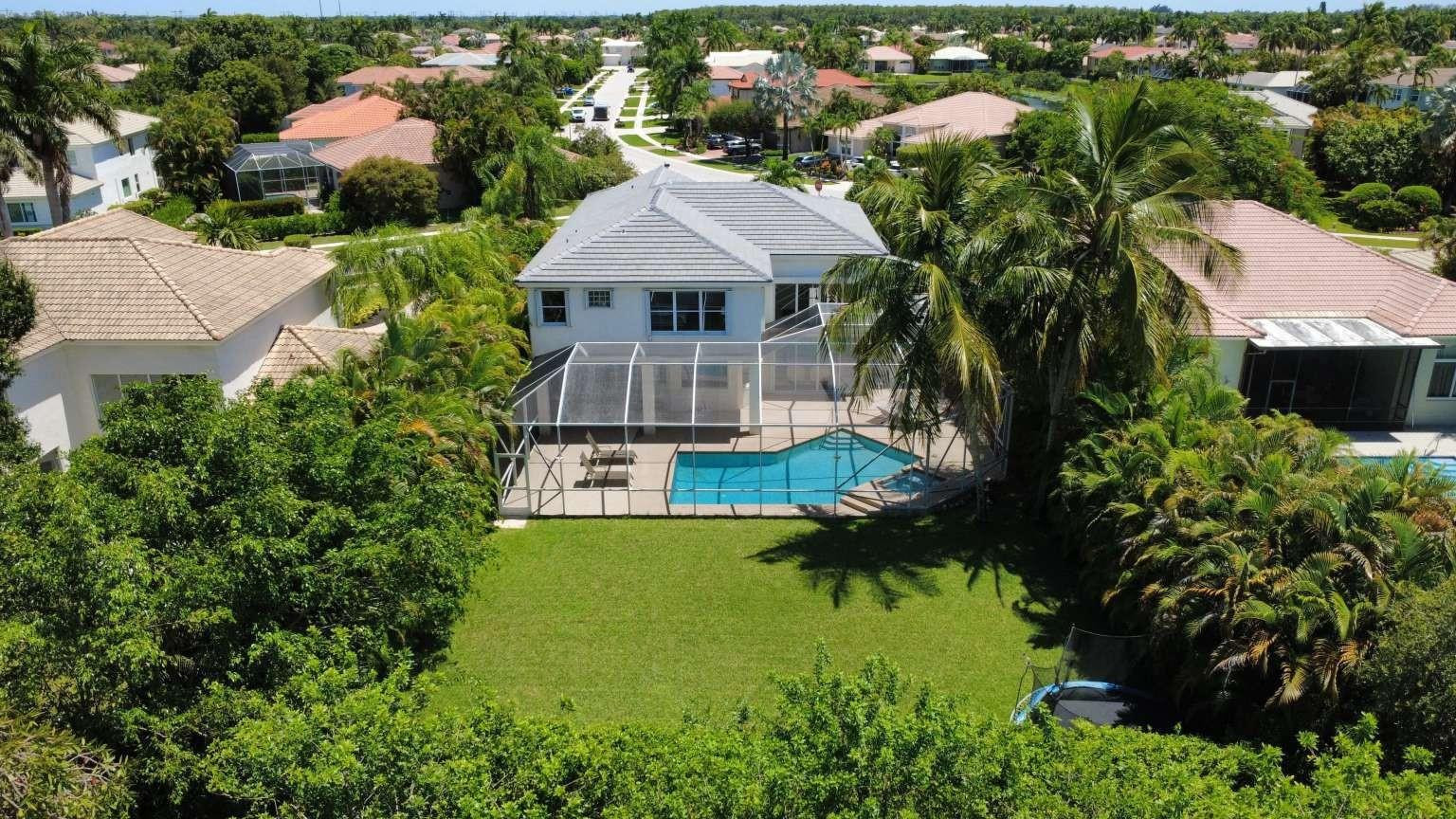 11119 Blue Coral Drive Boca Raton, FL 33498 - Photo 4 of 36 an aerial view of residential houses with yard