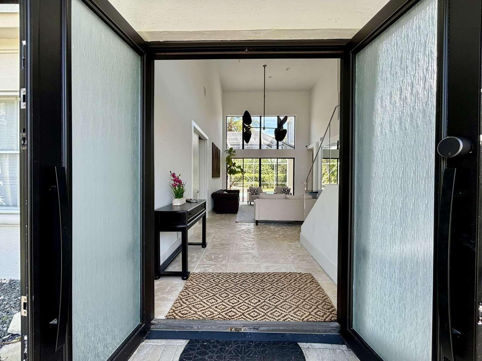 11119 Blue Coral Drive Boca Raton, FL 33498 - Photo 5 of 36 a living room with furniture and a rug