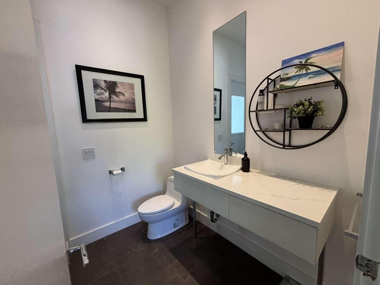 11119 Blue Coral Drive Boca Raton, FL 33498 - Photo 10 of 36 a bathroom with a sink and a mirror