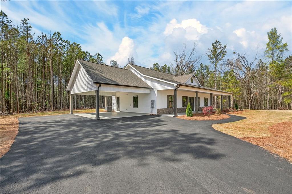 3512 Vinson Mountain Road Rockmart, GA 30153 - Photo 6 of 51 a front view of a house with garden