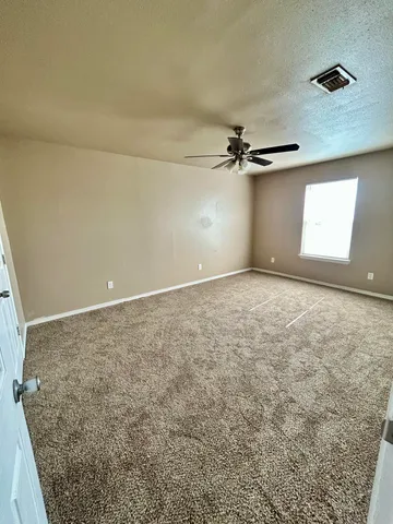 en view of a room with a ceiling fan