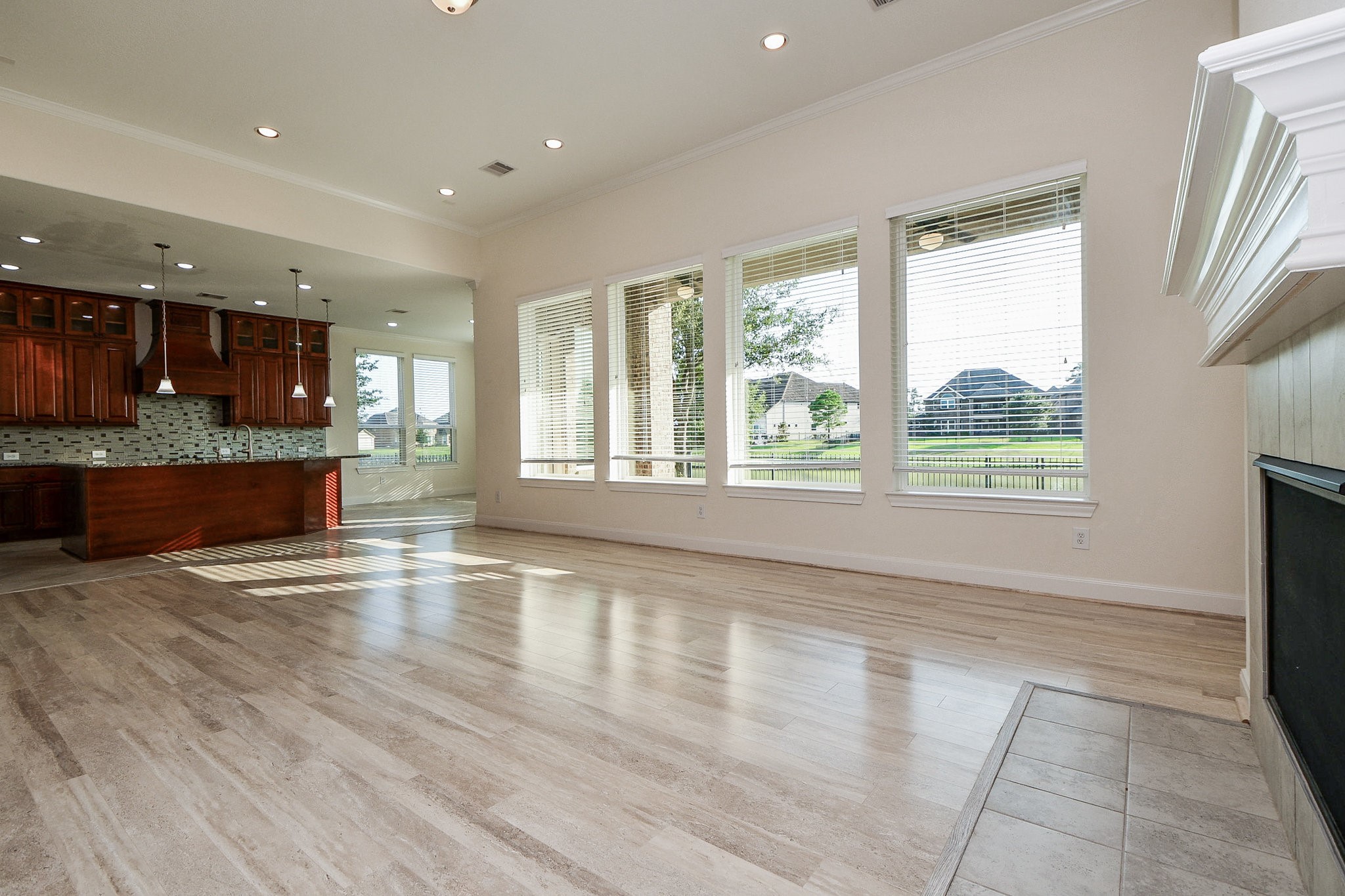 3618 Meandering Spring Drive Katy, TX 77494 - Photo 10 of 50 a view of open kitchen with granite countertop a stove top oven a sink and a granite counter top