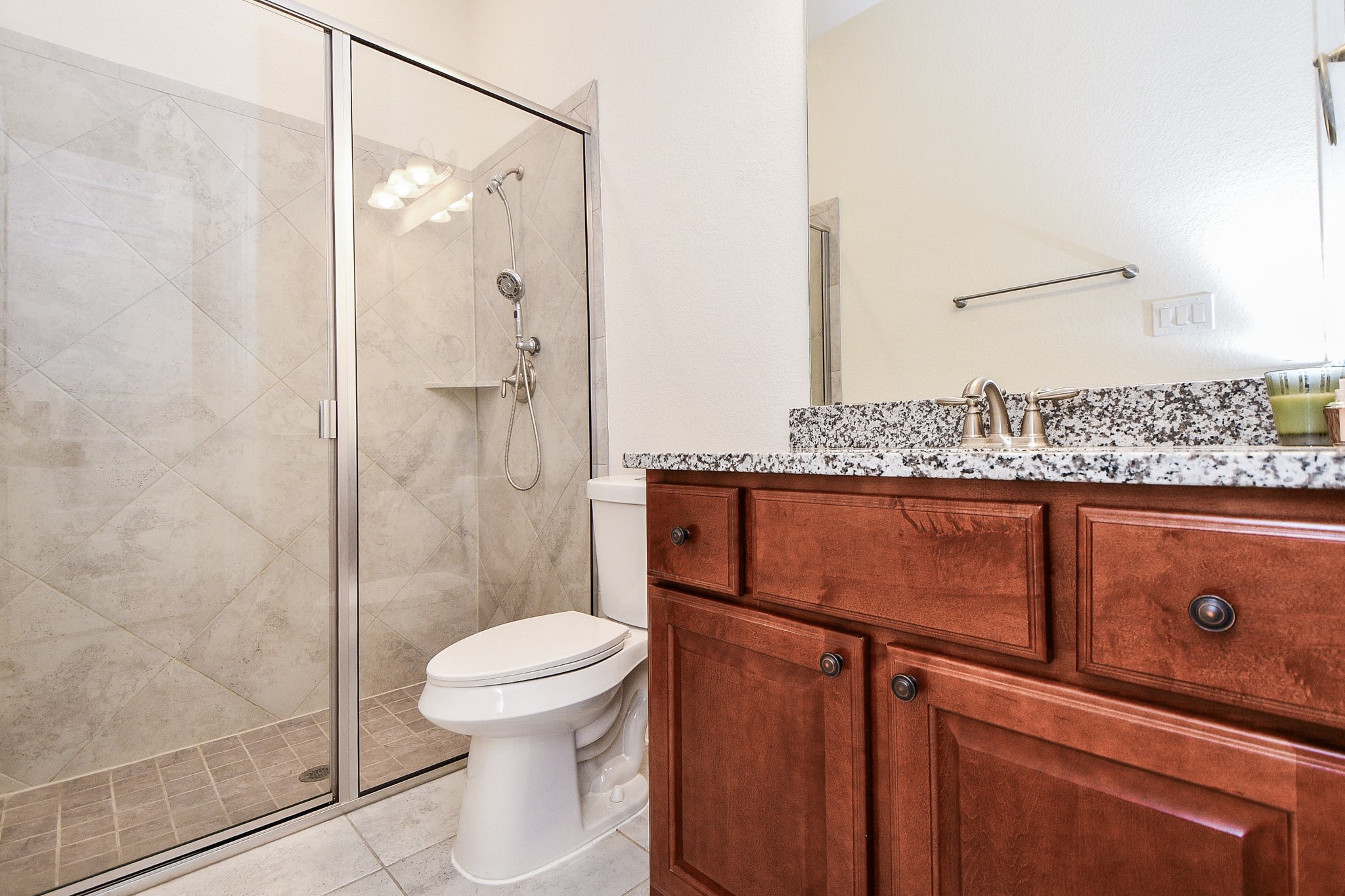 3618 Meandering Spring Drive Katy, TX 77494 - Photo 22 of 50 a bathroom with a granite countertop sink mirror vanity and toilet