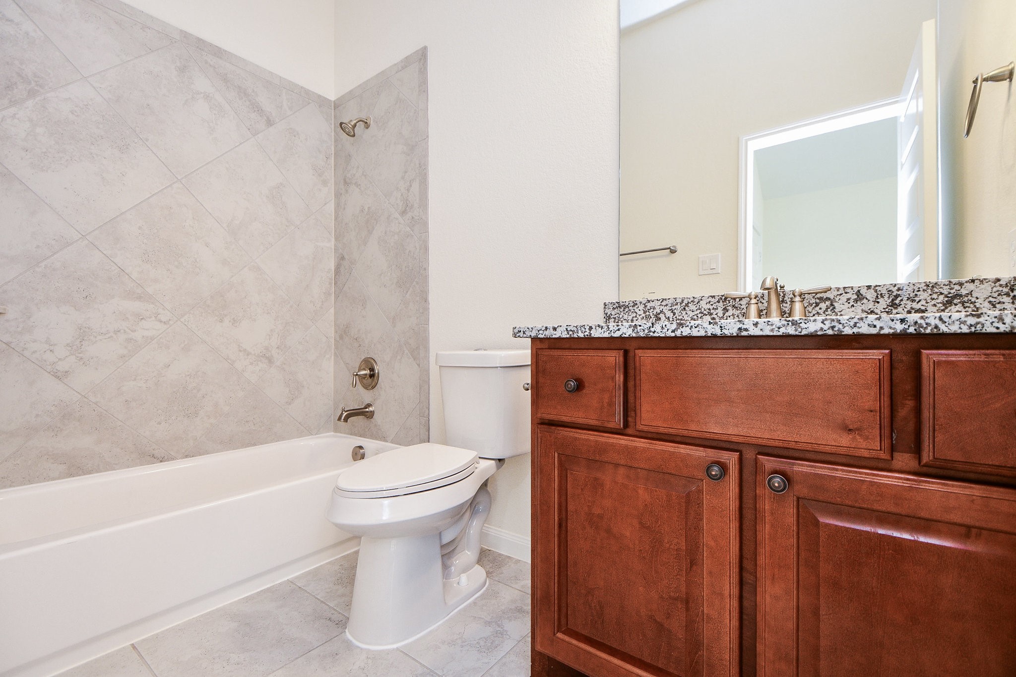 3618 Meandering Spring Drive Katy, TX 77494 - Photo 37 of 50 a bathroom with a toilet a sink and bathtub