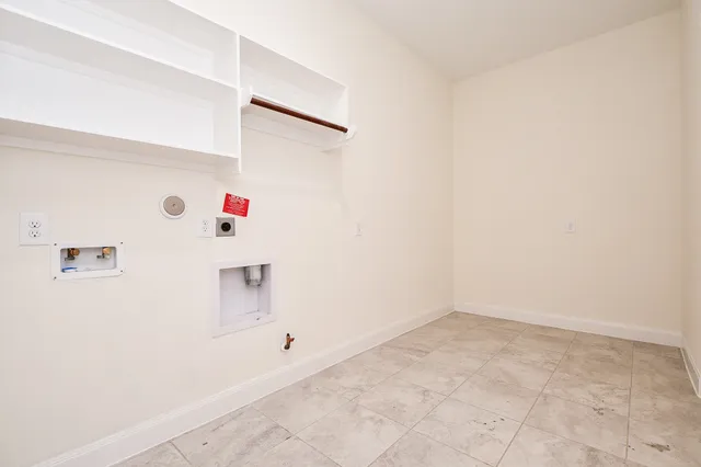 a view of an empty room with windows