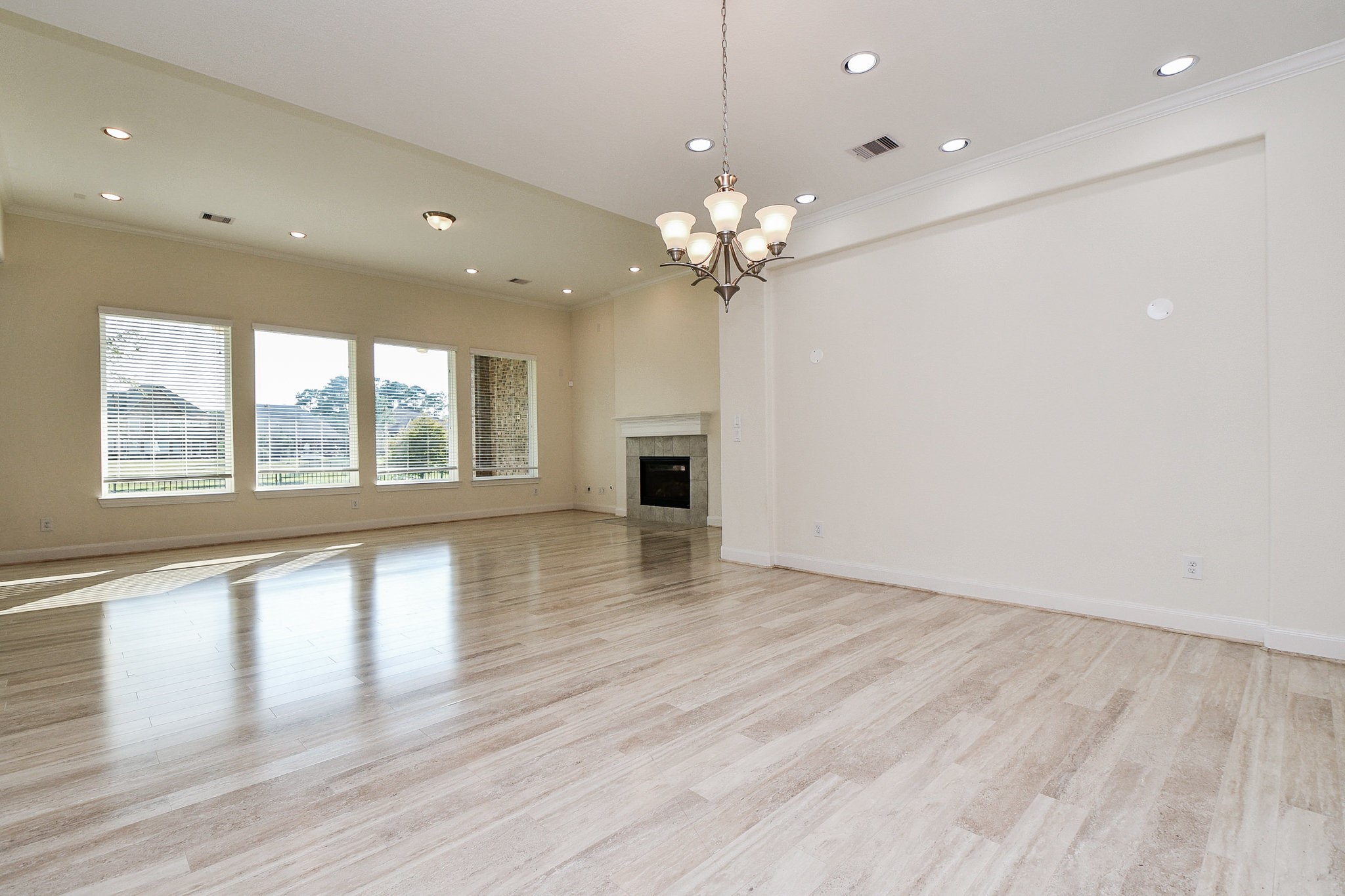 3618 Meandering Spring Drive Katy, TX 77494 - Photo 6 of 50 an empty room with wooden floor and windows