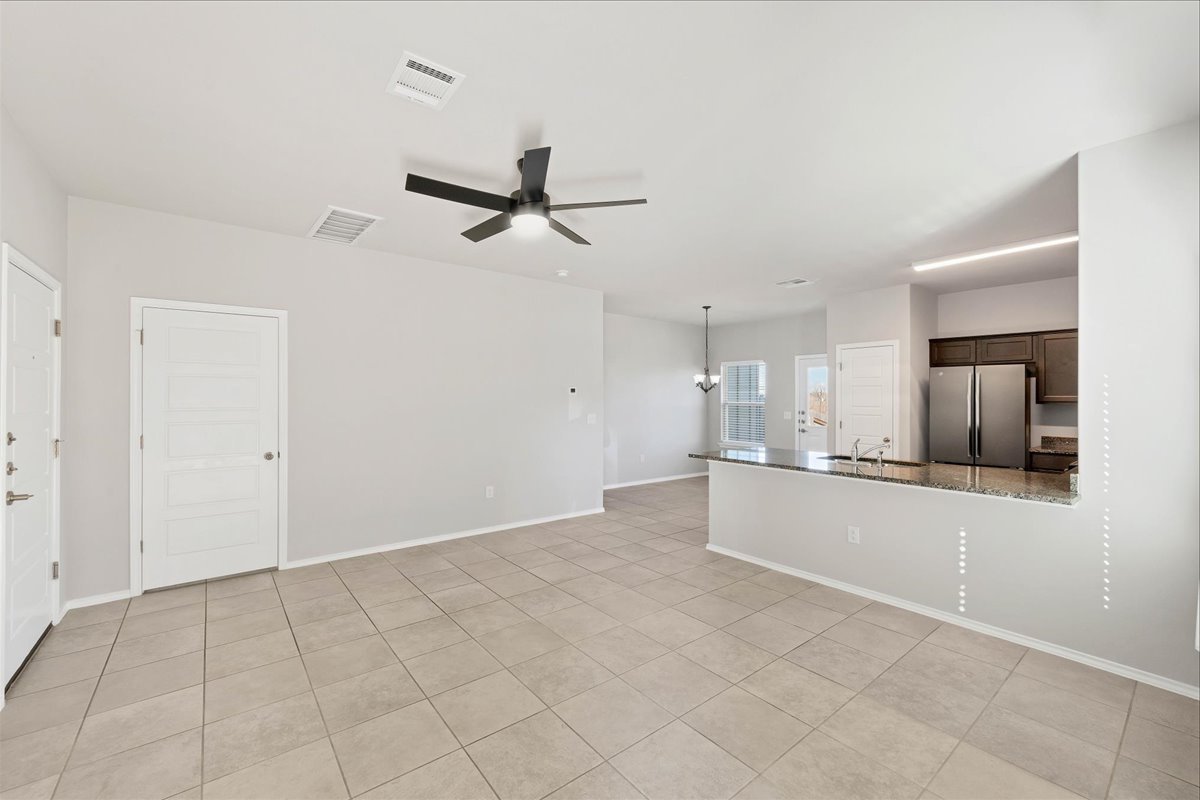 1202 Garland Road Georgetown, TX 78626 - Photo 10 of 28 Open-concept living area featuring tile flooring, a contemporary ceiling fan, and recessed lighting