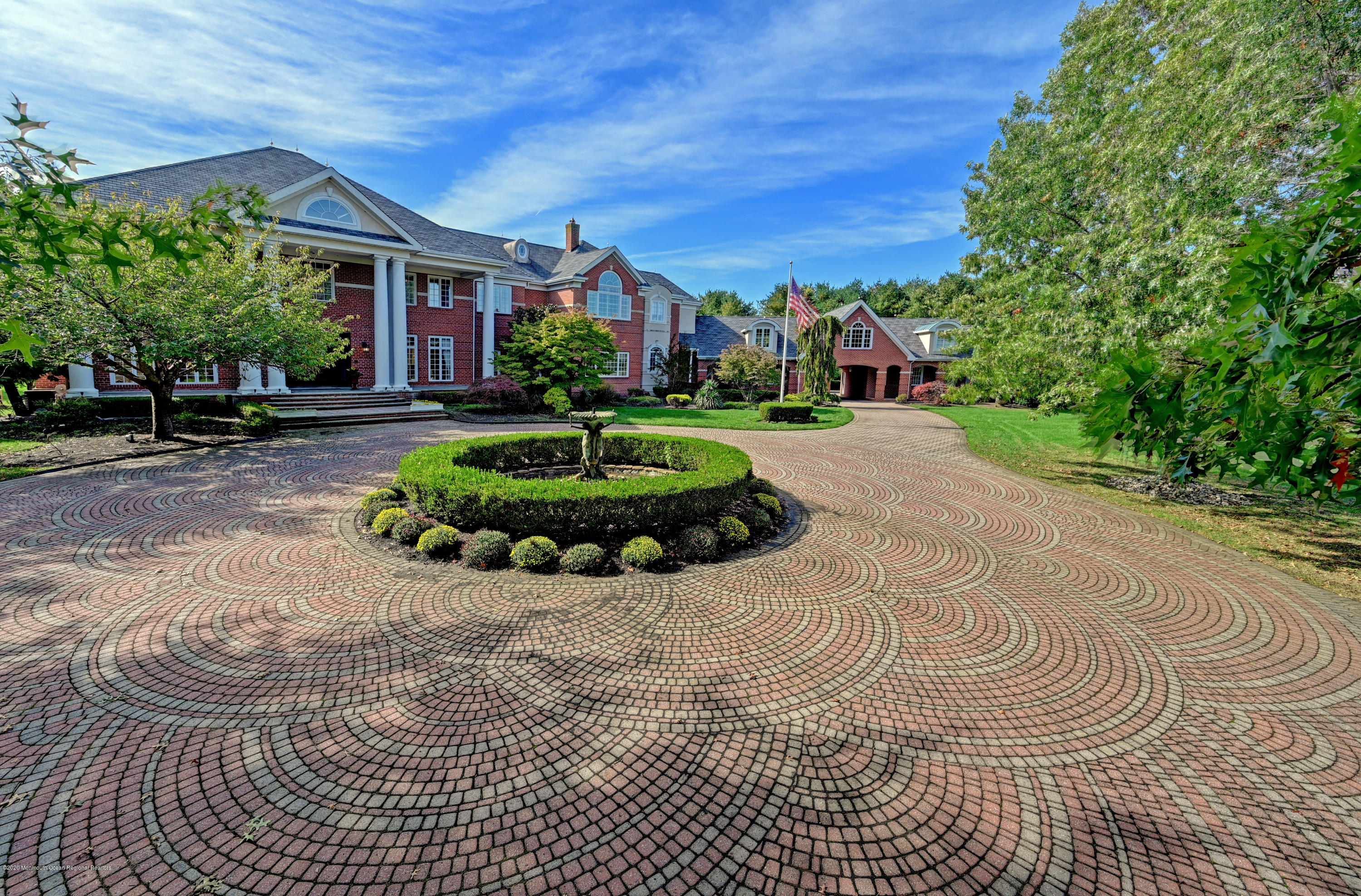 1 Laredo Drive Colts Neck, NJ 07722 - Photo 2 of 78 a front view of a house with a yard
