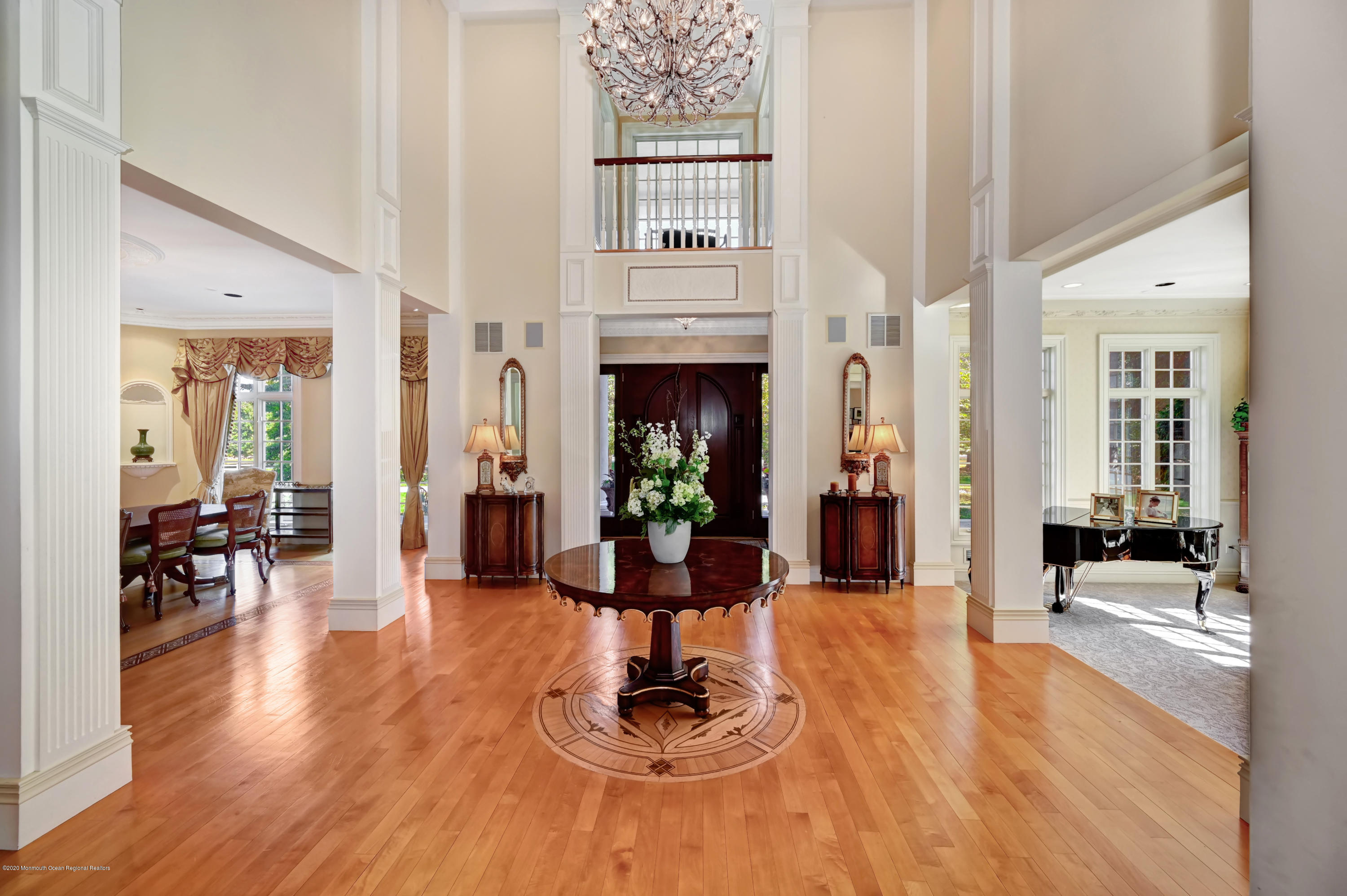 1 Laredo Drive Colts Neck, NJ 07722 - Photo 15 of 78 a living room with furniture a wooden floor and a fireplace