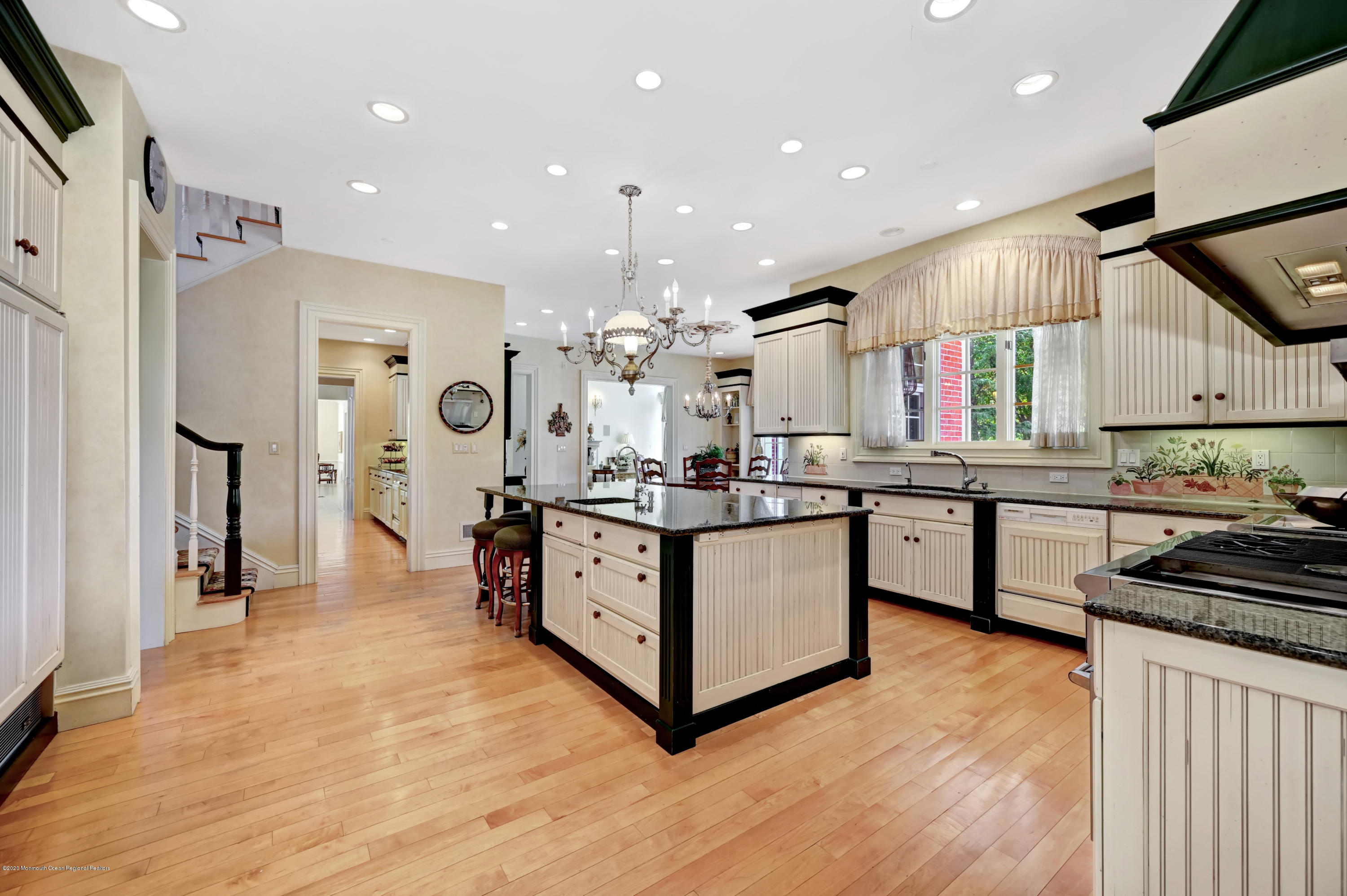 1 Laredo Drive Colts Neck, NJ 07722 - Photo 29 of 78 a kitchen with stainless steel appliances kitchen island sink refrigerator and cabinets