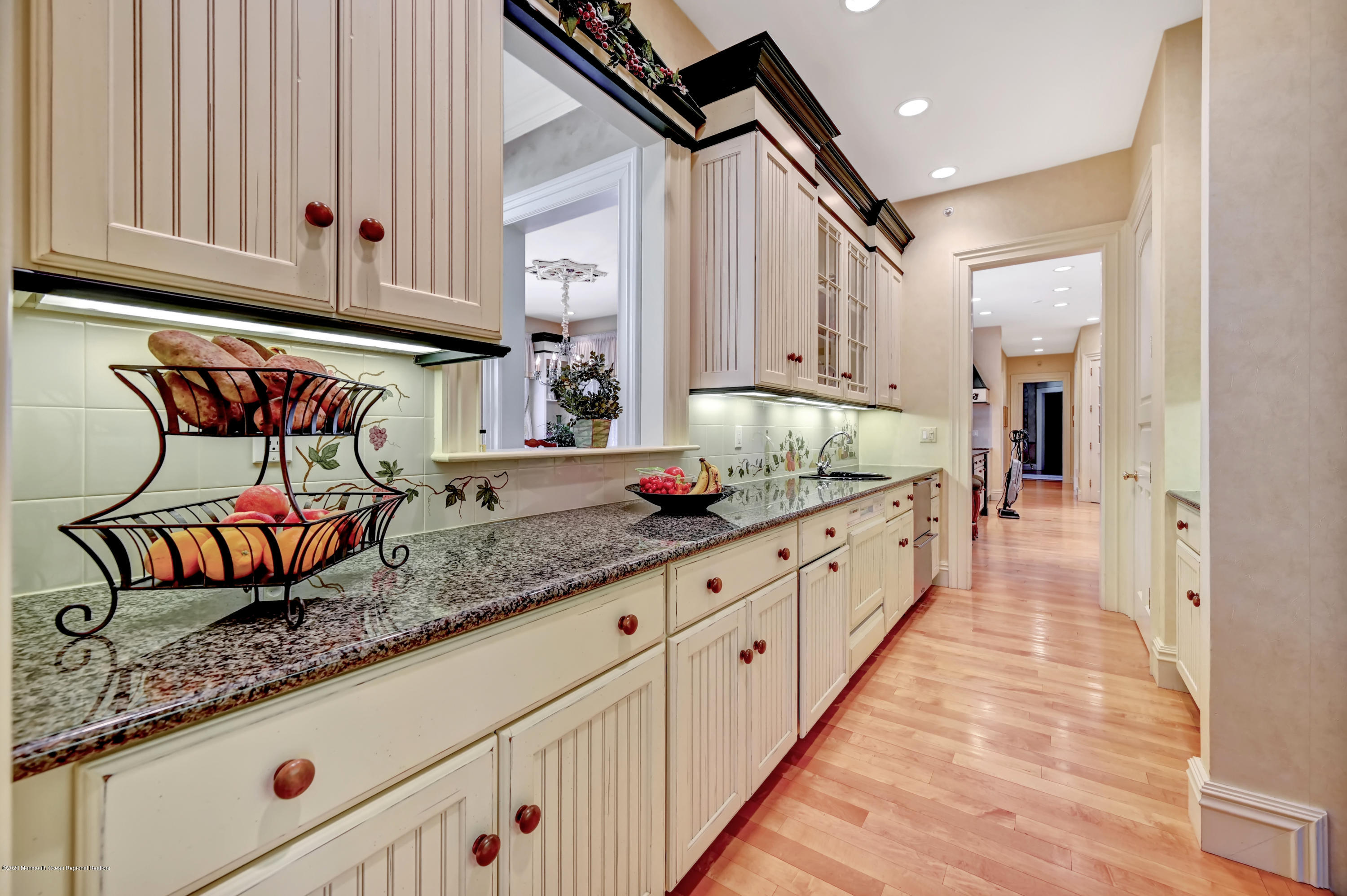 1 Laredo Drive Colts Neck, NJ 07722 - Photo 32 of 78 a kitchen with granite countertop a sink and cabinets