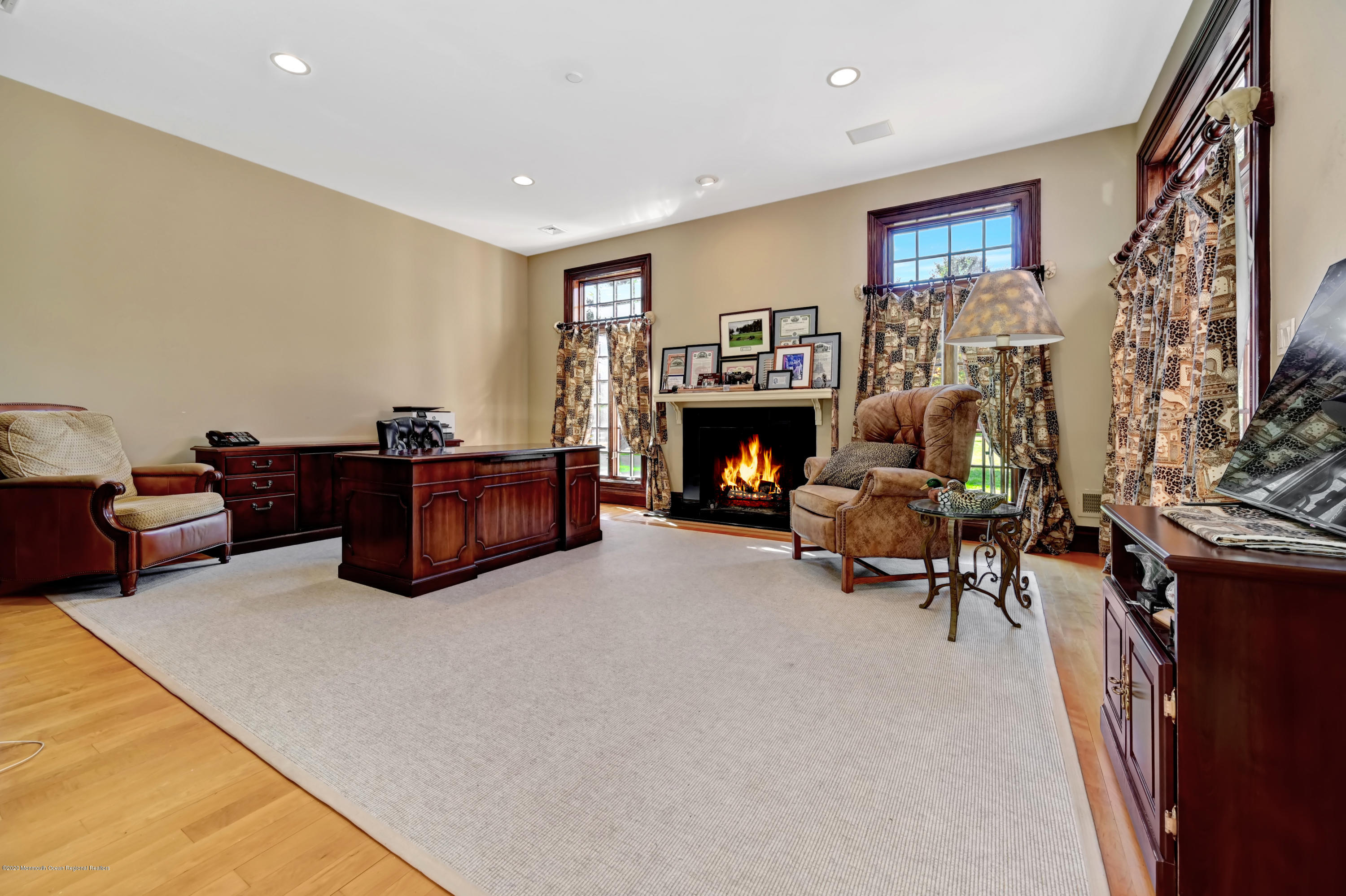 1 Laredo Drive Colts Neck, NJ 07722 - Photo 38 of 78 a living room with furniture and a fireplace