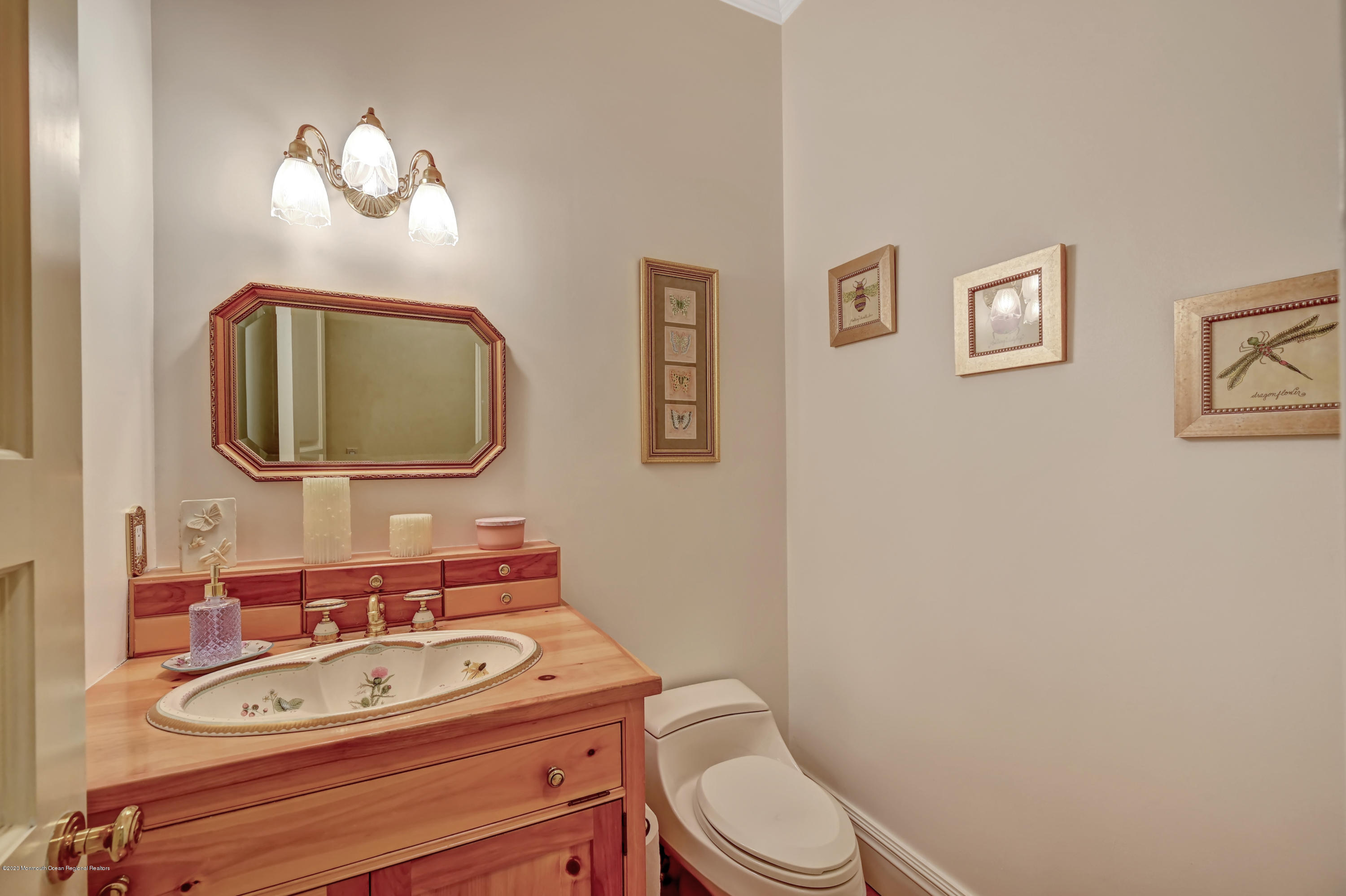1 Laredo Drive Colts Neck, NJ 07722 - Photo 48 of 78 a bathroom with a toilet a sink and mirror