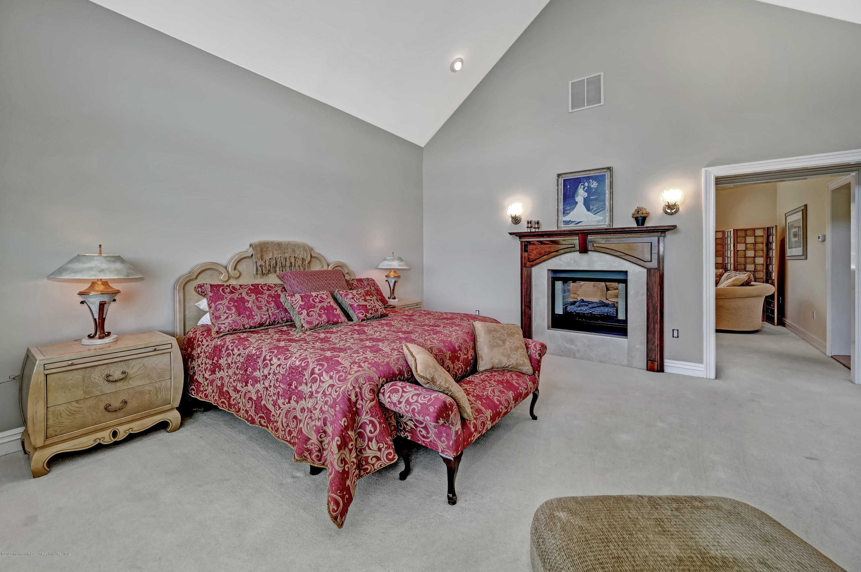 1 Laredo Drive Colts Neck, NJ 07722 - Photo 55 of 78 a spacious bedroom with a bed and a couch