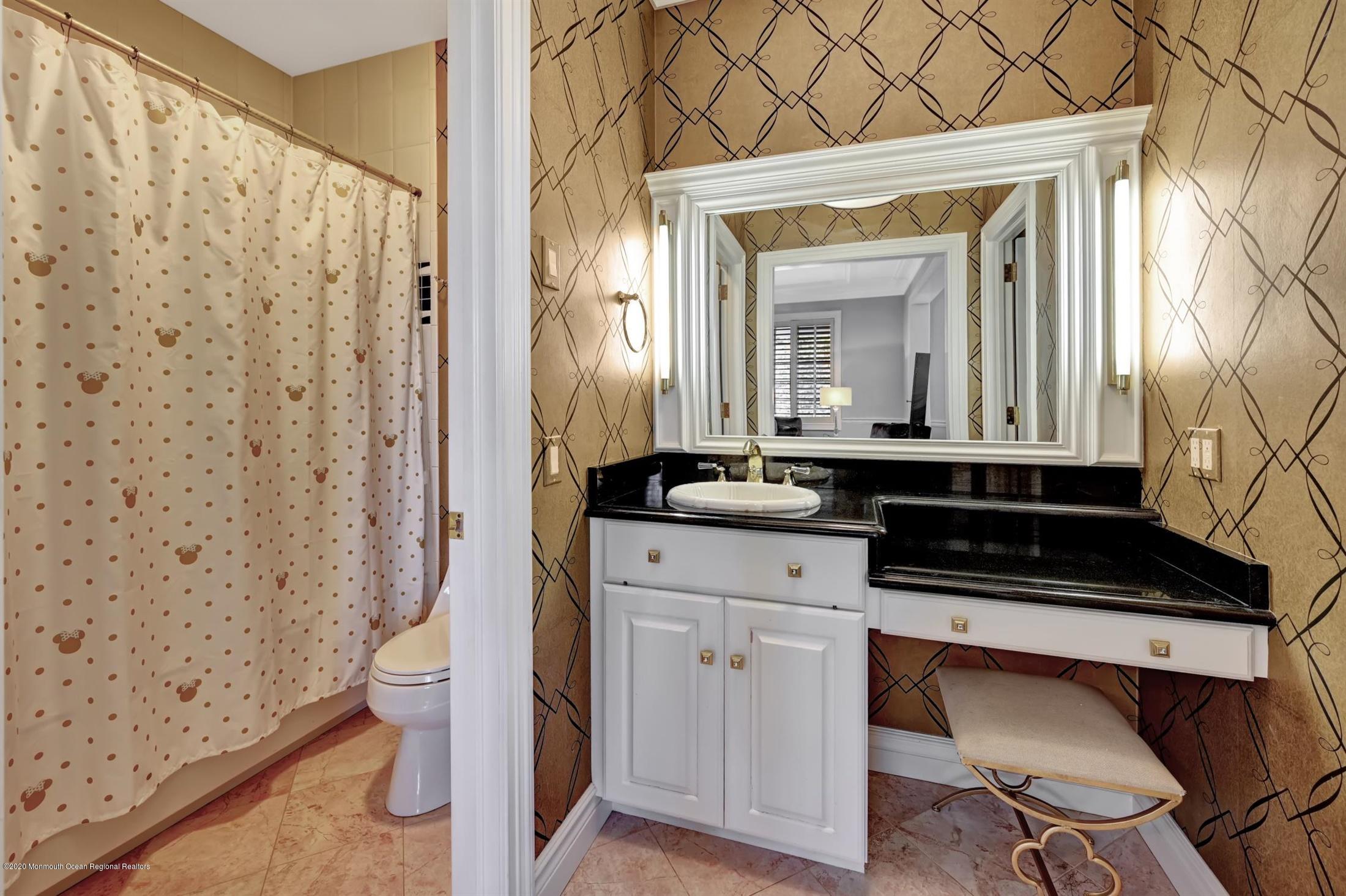 1 Laredo Drive Colts Neck, NJ 07722 - Photo 61 of 78 a bathroom with a sink a toilet and a mirror