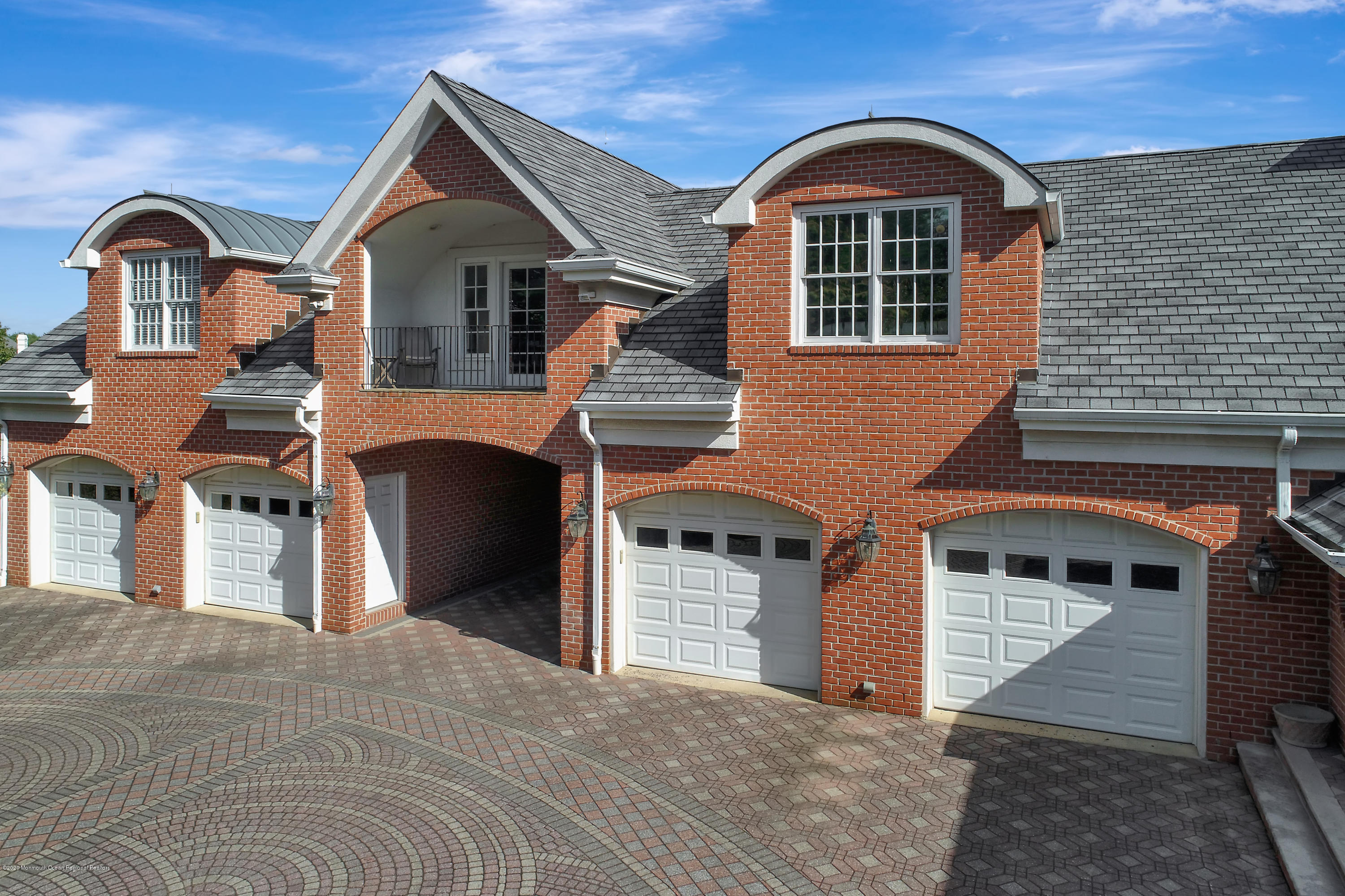 1 Laredo Drive Colts Neck, NJ 07722 - Photo 10 of 78 a front view of a house with a yard