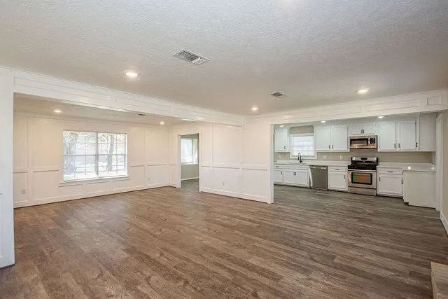 a view of kitchen with wooden floor
