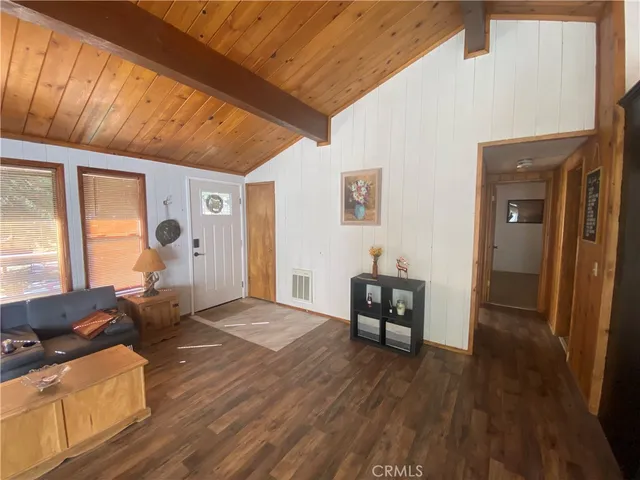 a view of a livingroom with furniture and wooden floor