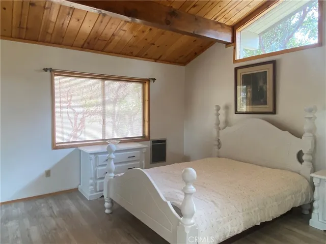 a bathroom with a granite countertop shower and a toilet