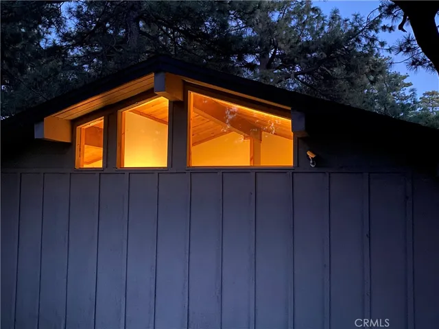 a patio with patio door and outdoor seating