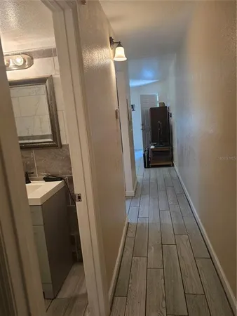 a view of washer and dryer with wooden floor