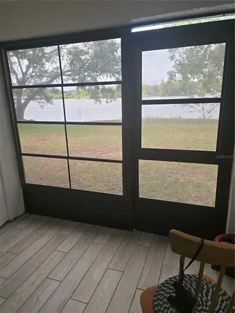 a view of a room with furniture and window