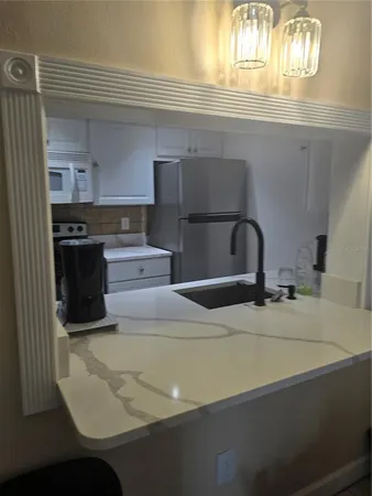 a kitchen with a sink and cabinets