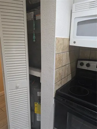 a close view of a utility room with washer and dryer