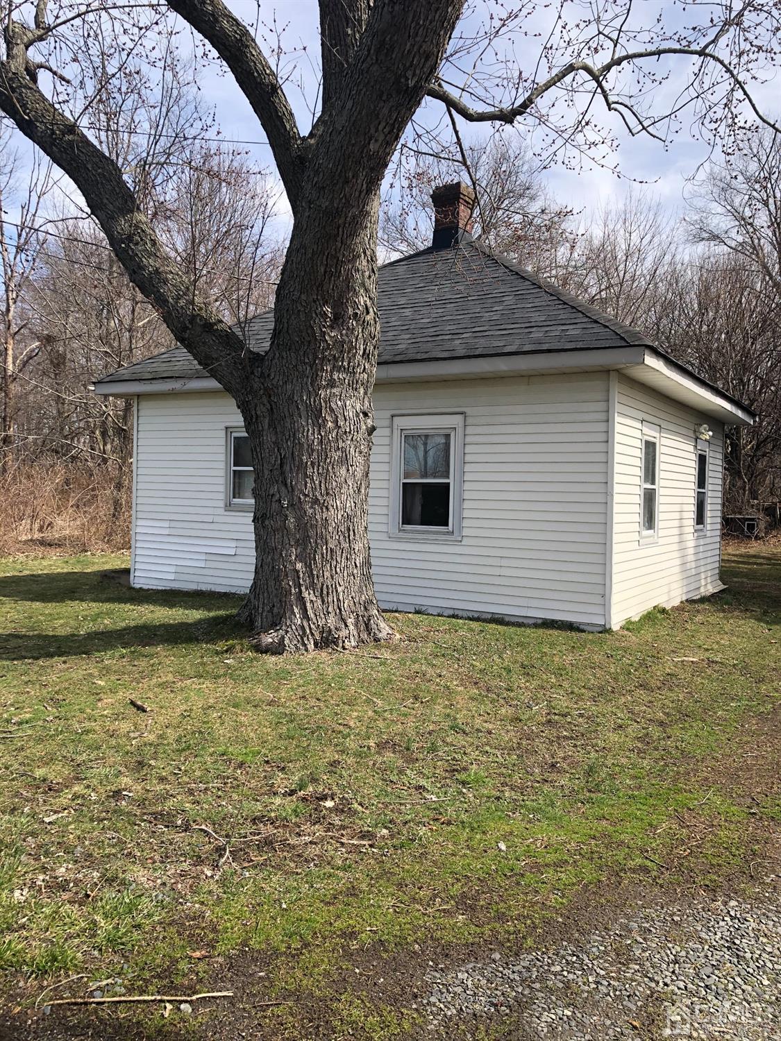 95 Halsey Reed Road Monroe Township, NJ 08831 - Photo 3 of 6 a house that has a tree in front of it