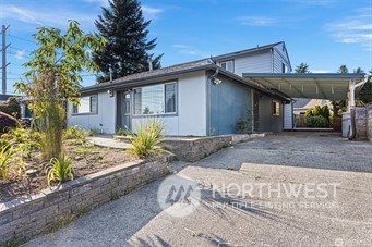 3306 Northeast 7th Place Renton, WA 98056 - Photo 2 of 11 a view of a house with a patio
