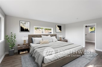 3306 Northeast 7th Place Renton, WA 98056 - Photo 6 of 11 a bedroom with a large bed and a potted plant