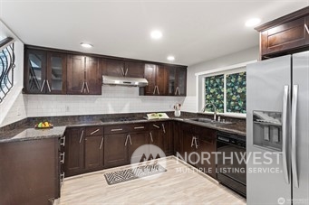3306 Northeast 7th Place Renton, WA 98056 - Photo 8 of 11 a kitchen with a sink cabinets and window