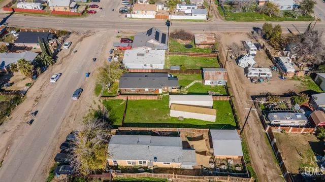 an aerial view of a houses with outdoor space