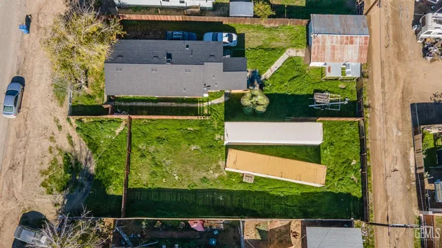 an aerial view of a house with a garden