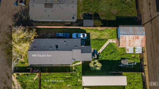 an aerial view of residential house with outdoor space and parking