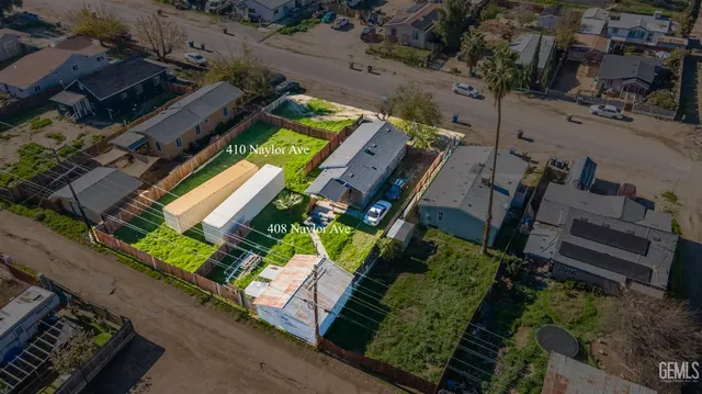 an aerial view of a residential apartment building with a yard