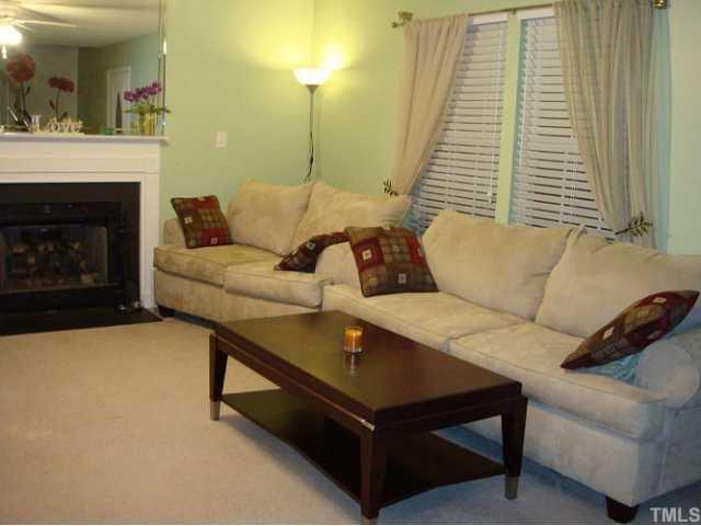 4025 Mardela Spring Drive Raleigh, NC 27616 - Photo 3 of 6 a living room with furniture and a fireplace