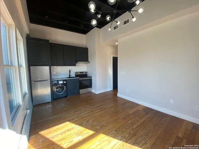 a kitchen with stainless steel appliances a refrigerator and a sink