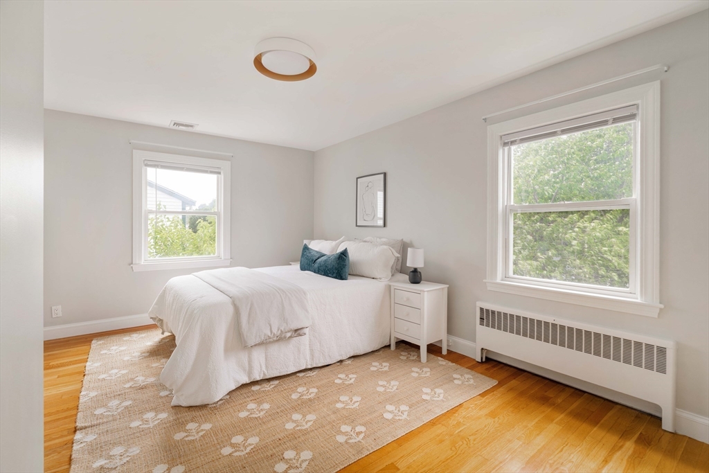 41 Wilson Avenue, Unit 41 Watertown, MA 02472 - Photo 14 of 22 a bedroom with a bed and a window