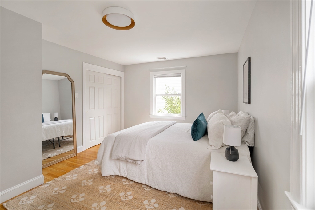 41 Wilson Avenue, Unit 41 Watertown, MA 02472 - Photo 15 of 22 a bedroom with a bed and a window