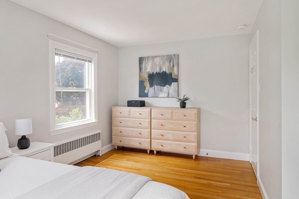41 Wilson Avenue, Unit 41 Watertown, MA 02472 - Photo 16 of 22 a room with a bed and a window