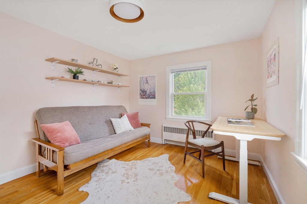 41 Wilson Avenue, Unit 41 Watertown, MA 02472 - Photo 19 of 22 a living room with furniture and a window