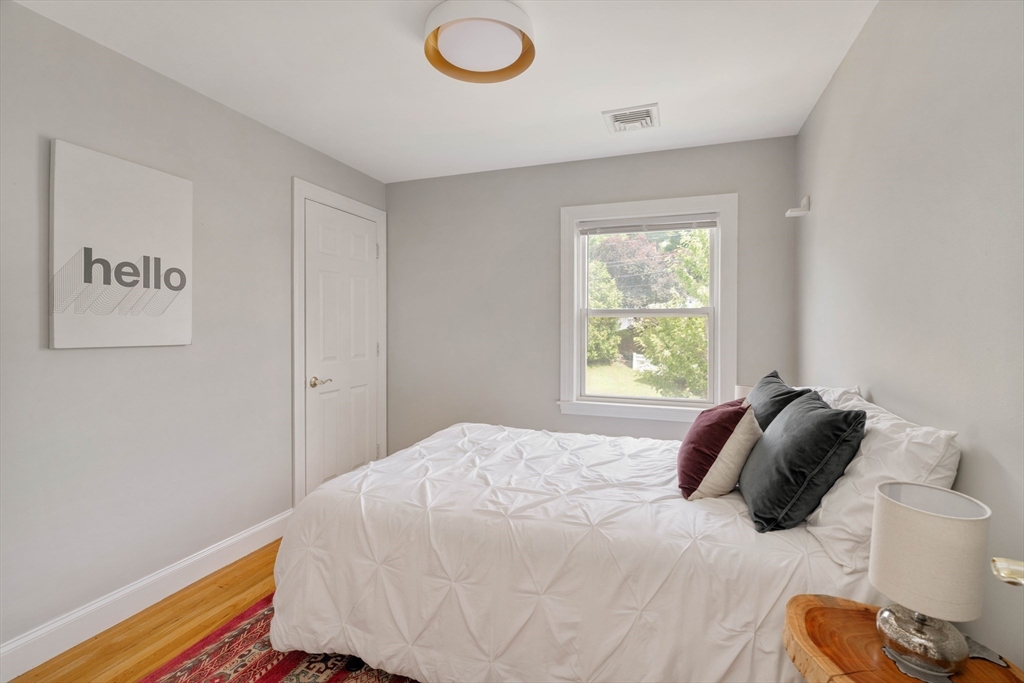 41 Wilson Avenue, Unit 41 Watertown, MA 02472 - Photo 20 of 22 a bedroom with a bed and a window