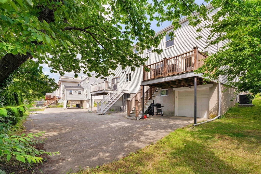 41 Wilson Avenue, Unit 41 Watertown, MA 02472 - Photo 21 of 22 a view of a house with a yard