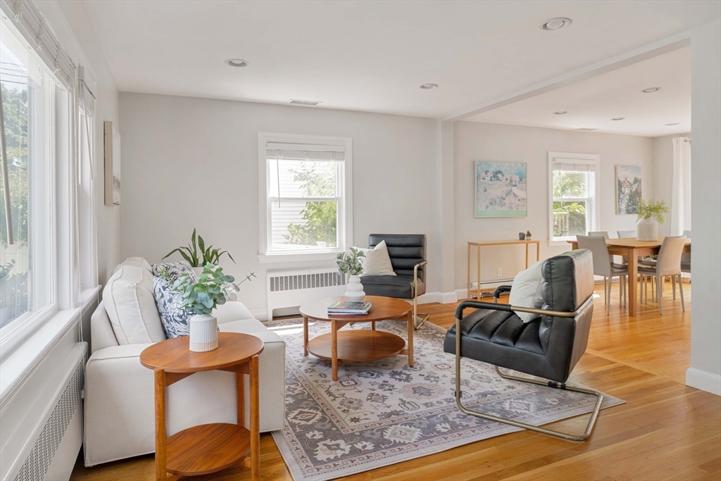 41 Wilson Avenue, Unit 41 Watertown, MA 02472 - Photo 8 of 22 a living room with furniture potted plant and a window