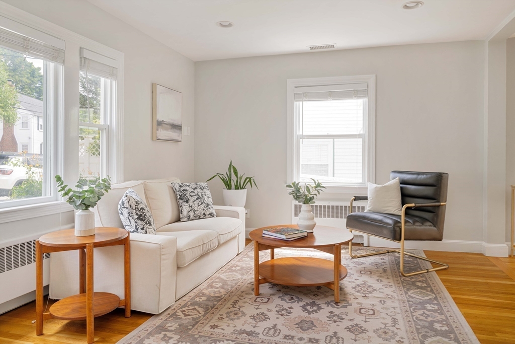 41 Wilson Avenue, Unit 41 Watertown, MA 02472 - Photo 9 of 22 a living room with furniture and a rug