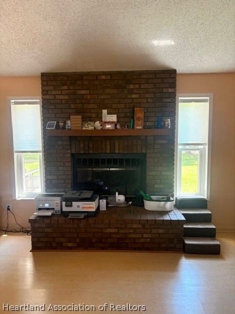 5330 Lakewood Road Sebring, FL 33875 - Photo 2 of 19 a living room with fireplace furniture and a large window