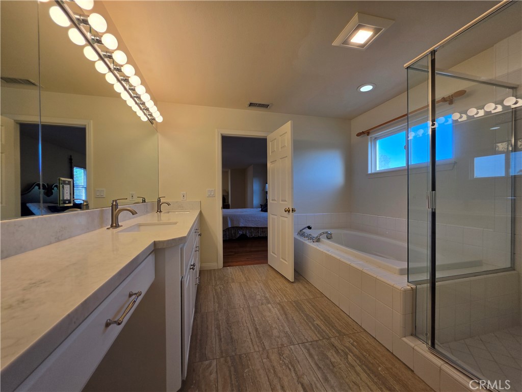 11541 Donovan Road Rossmoor, CA 90720 - Photo 64 of 113 Primary Bathroom walk in shower and jetted tub plus linen closet