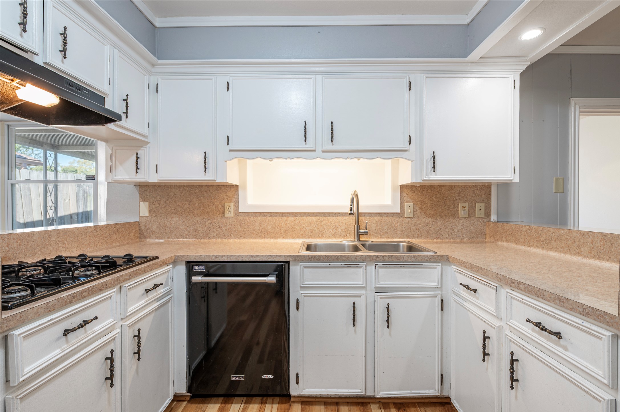 13727 Oleoke Lane Houston, TX 77015 - Photo 15 of 42 a kitchen with granite countertop a sink stove and cabinets